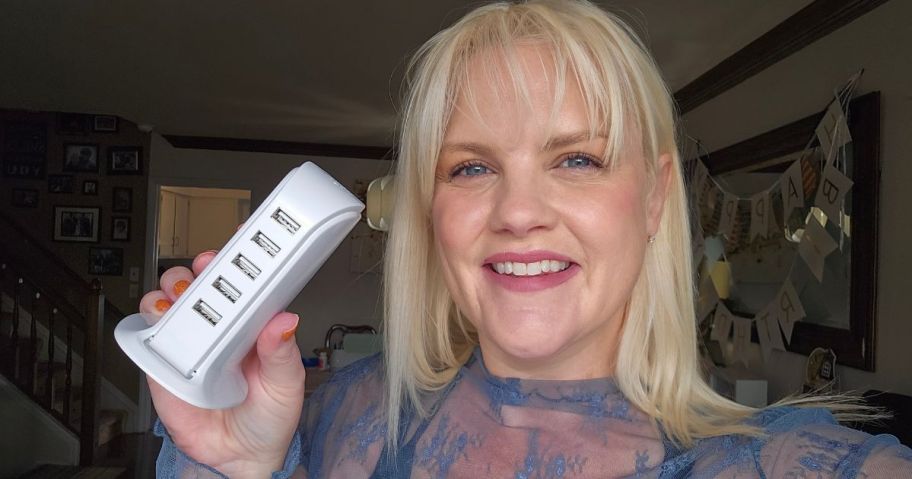 woman holding 5-port charging hub