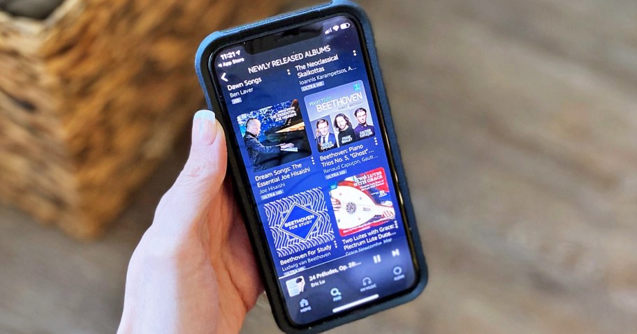 hand holding a phone with Amazon Music app