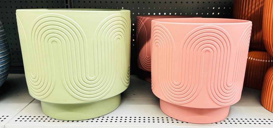 green and pink planters with wave designs