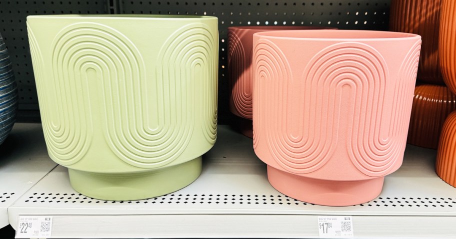 green and pink planters with wave designs