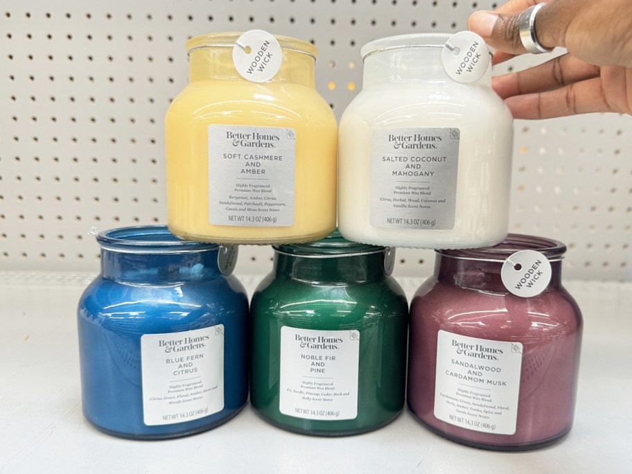 stack of jar candles on store shelf