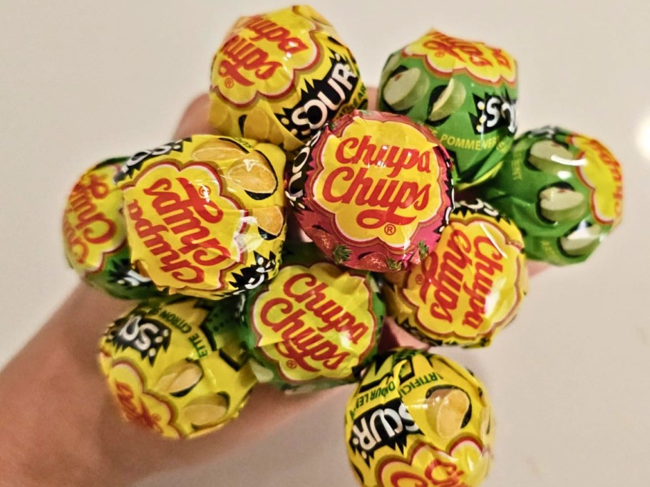 bunch of chupa chups sour lollipops in multiple flavors