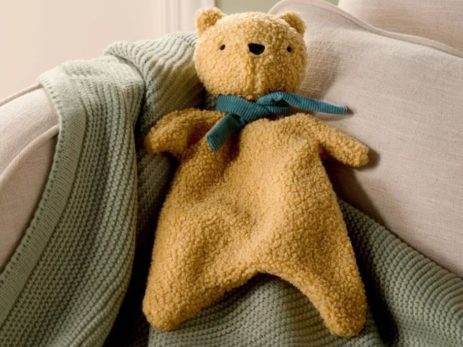 Cloud Island Bear Security Blanket on couch