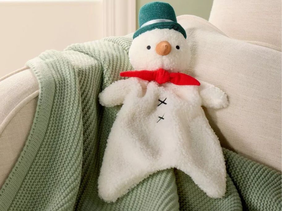 Cloud Island Snowman Security Blanket on couch