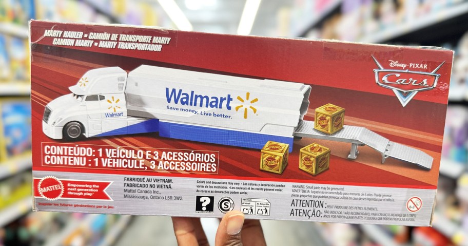 hand holding up the box for a Walmart truck toy