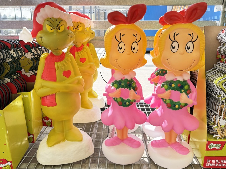 Dr. Seuss Grinch & Cindy Lou Who blow molds on store shelf