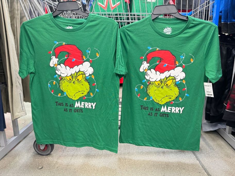 Dr. Seuss Men's Merry Grinch Graphic Long-Sleeve Tees hanging on cart in store