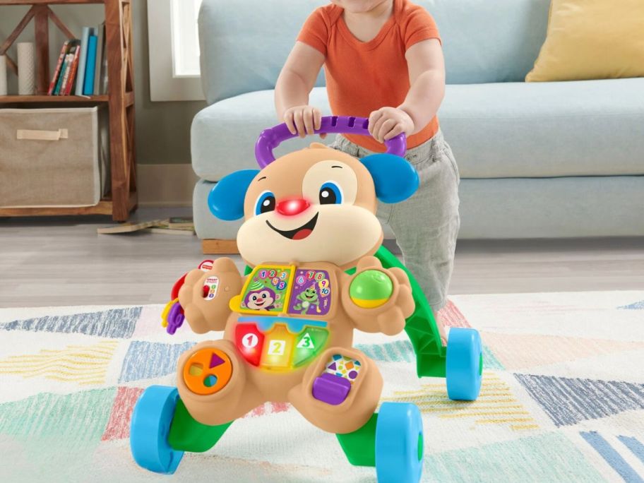 kid pushing Fisher-Price Laugh & Learn Puppy Walker