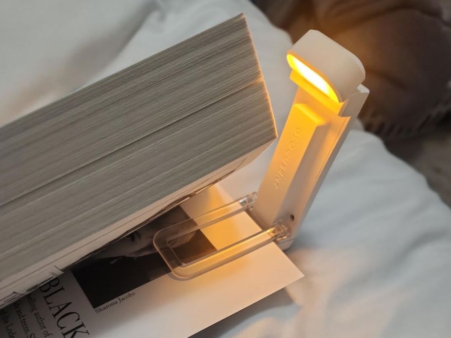 A book light clipped on a book