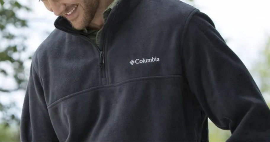 man wearing a navy blue Columbia fleece zip pullover