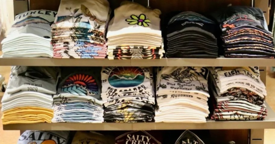 store display table full of graphic tees