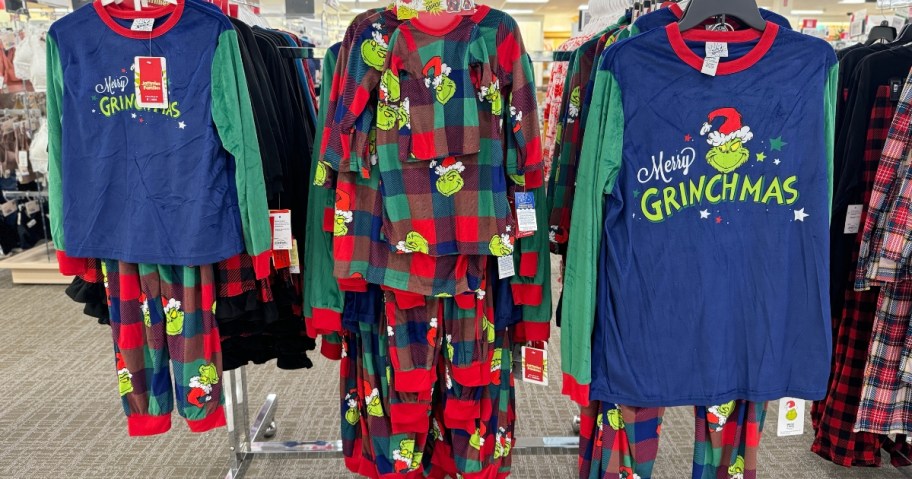 family matching The Grinch Christmas pajamas in kids, toddler, and adult styles on a rack at Kohl's