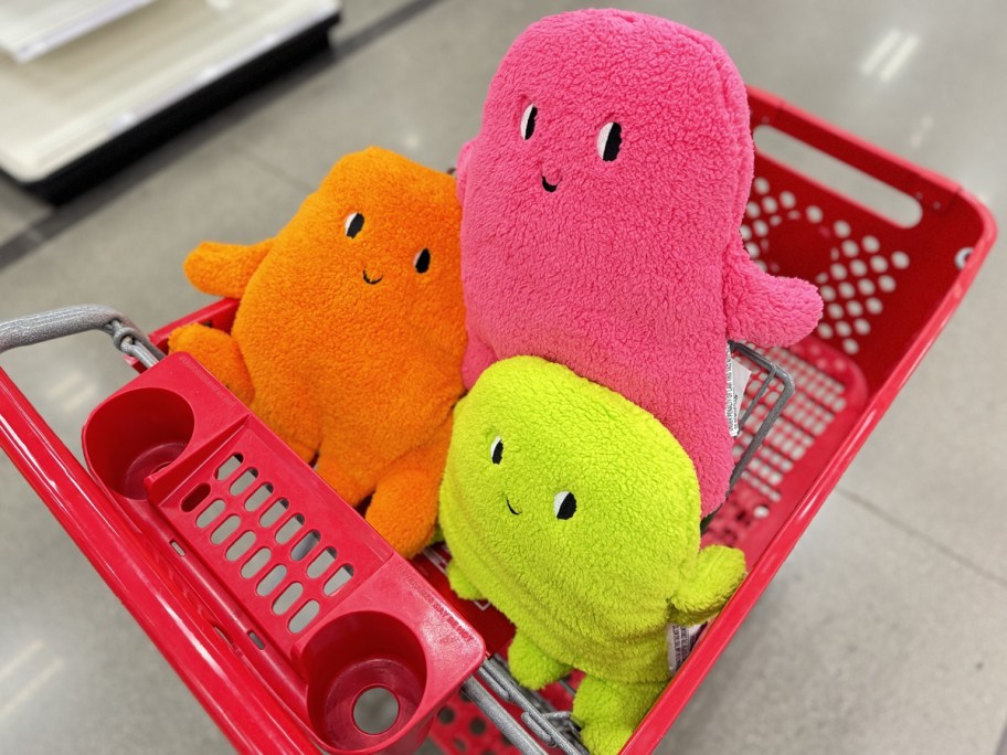 neon green, pink, and orange ghost throw pillows in target shopping cart