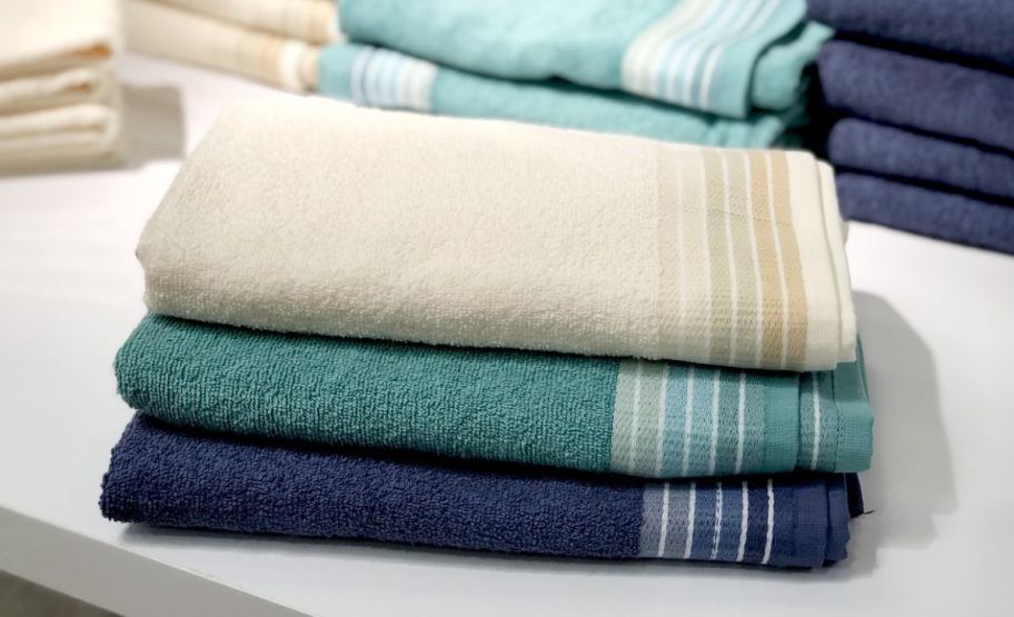 a stack og colorful towels in a jcpenney store