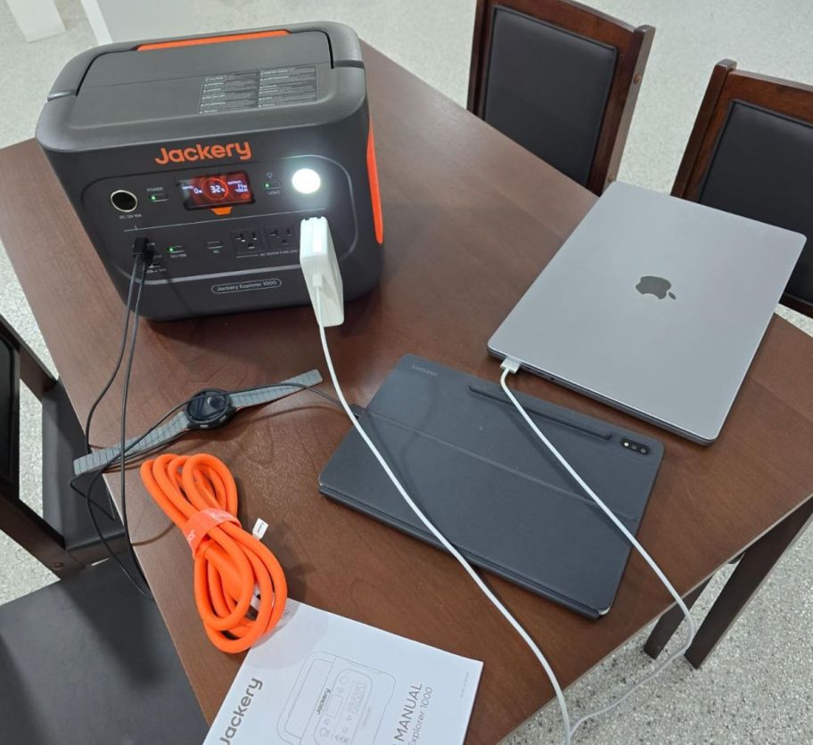 jackery power station shown with a laptop plugged in to charge