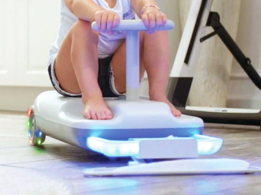 girl riding on electric cart with led headlights and mopping pad