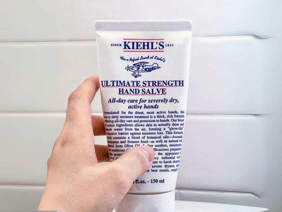 hand holding Kiehl's Ultimate Strength Hand Salve 5oz