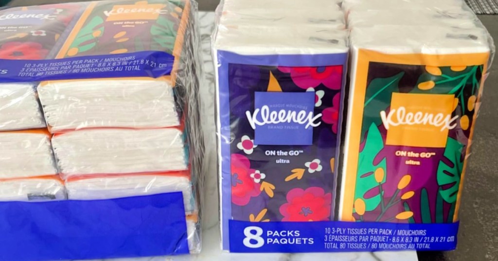 8 single packs of kleenex on countertop