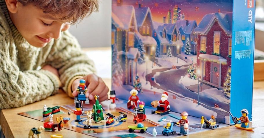 Boy playing with a LEGO City Advent Calendar