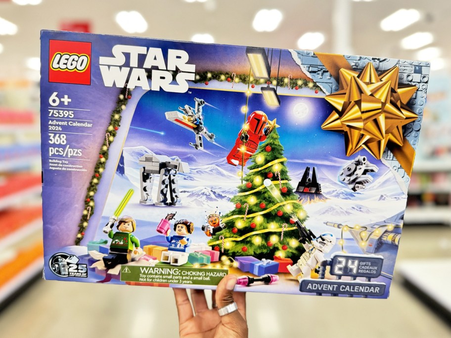 hand holding up LEGO Star Wars Advent Calendar in store