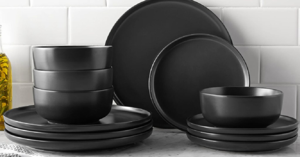 Mainstays Black Stoneware Collection in front of white tile wall