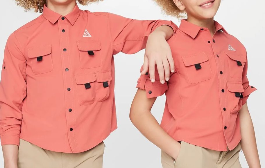 Stock image of two kids wearing Nike Hiking tops