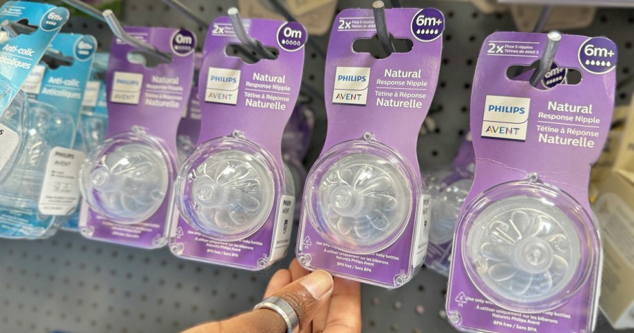 hand grabbing Philips Avent Natural Response Nipple 2-Pack from store display