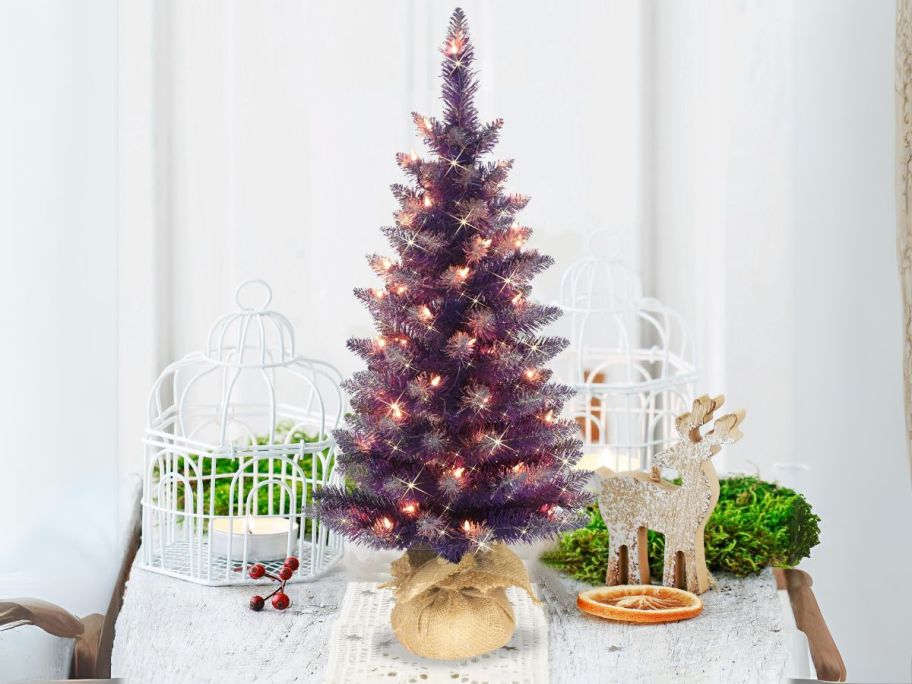 Puleo International 3' Pre-Lit Fashion Purple Artificial Christmas Tree on table