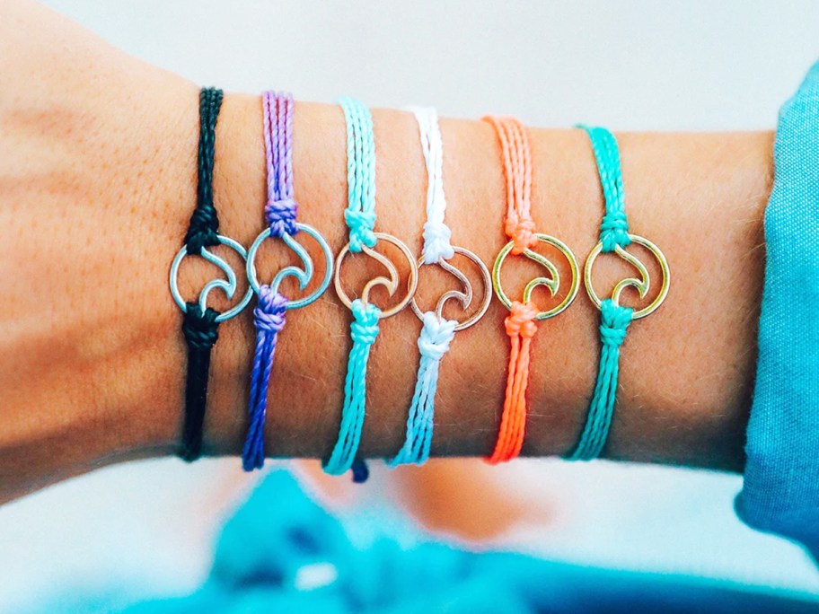 arm with colorful wave bracelets