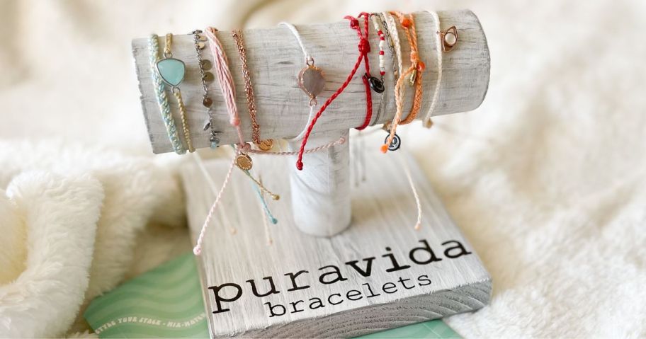 A barecelet stand with pura vida bracelets on it