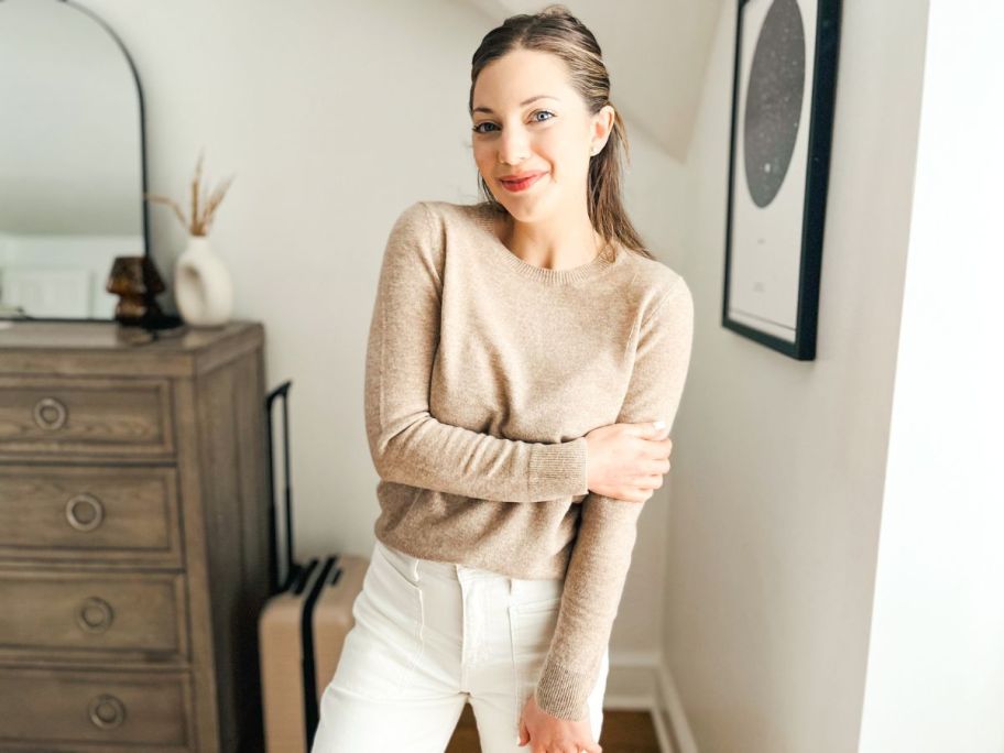 woman weating an oatmeal colored Quince cashmere sweater