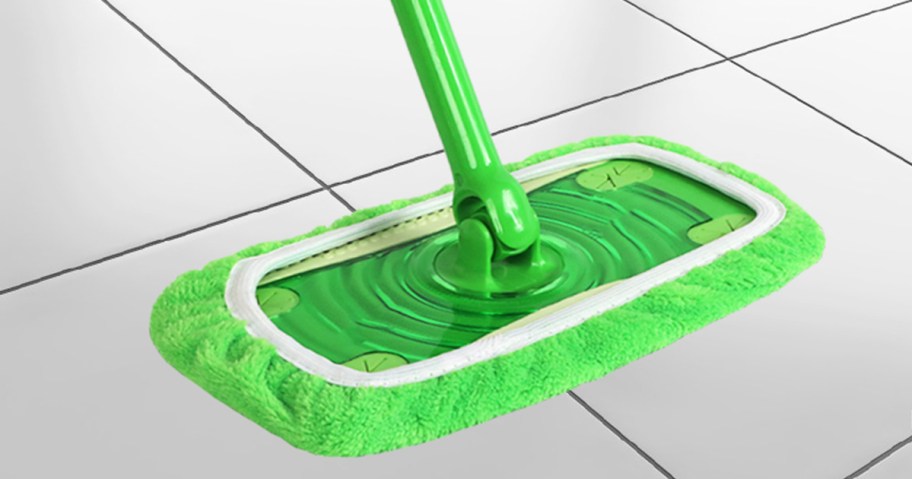 green reusable mop pad on a green swiffer