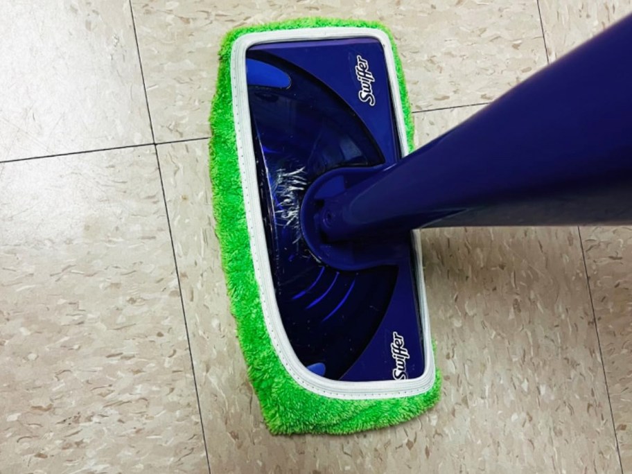 green reusable mop pad on a purple swiffer