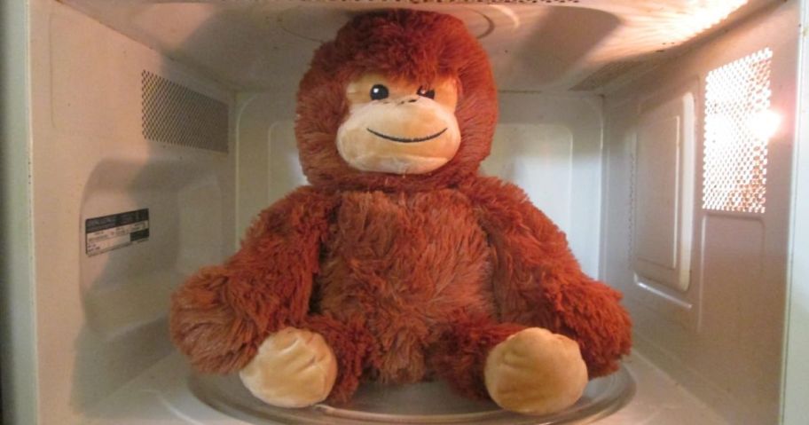 A plush monkey in a microwave