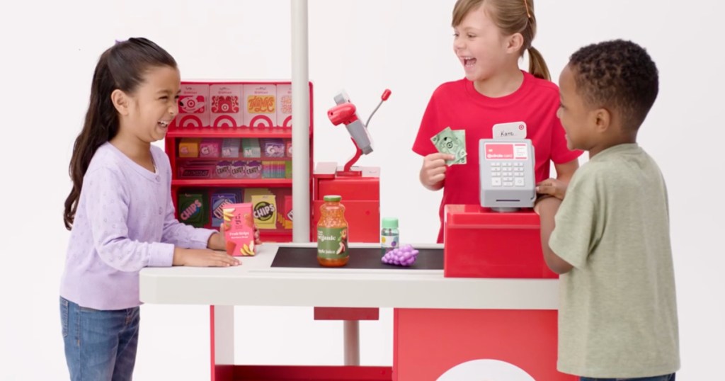 kids playing make believer with Target toy check lane