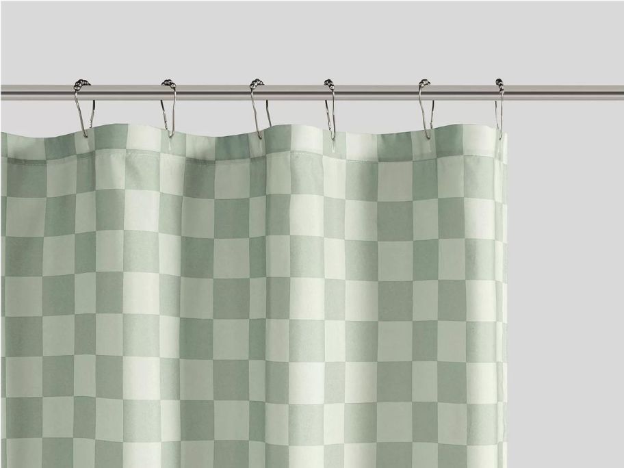 A green and white checkered shower curtain