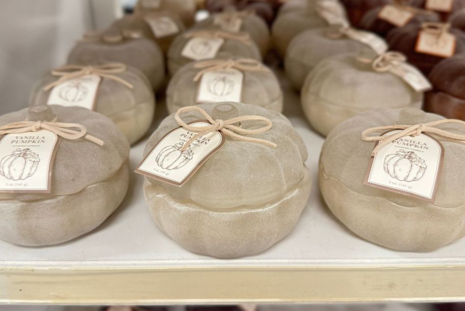 white frosted threshold 2 wick candles displayed on a store shelf