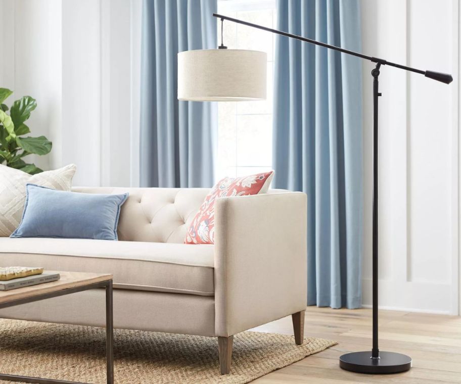 Threshold Cantilever Drop Pendant Swing Arm Floor Lamp Brown in a living room