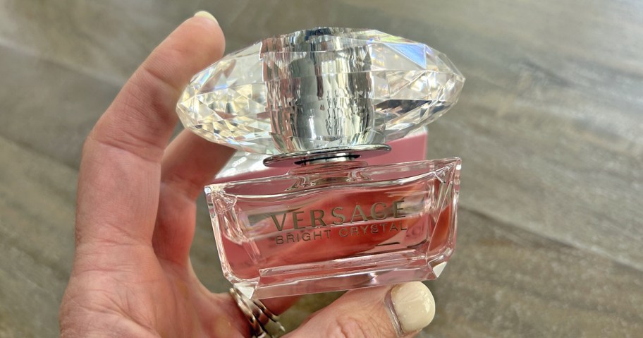 hand holding a bottle of Versace Bright Crystal