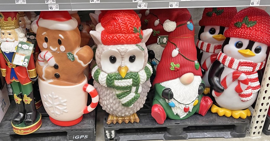 various christmas blow molds on display in store