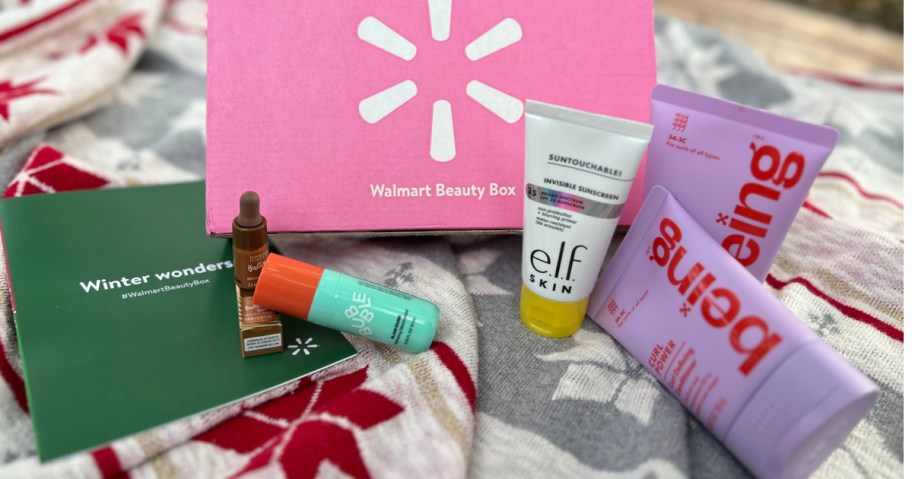 Contents of Walmart, winter beauty box on holiday blanket