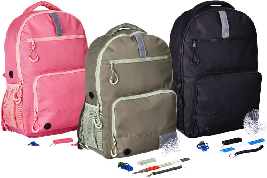 pink, green, and black backpacks with fidget toys