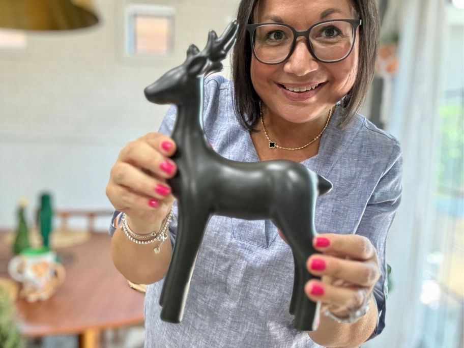 woman holding Wondershop Standing Deer Christmas Animal Figurine