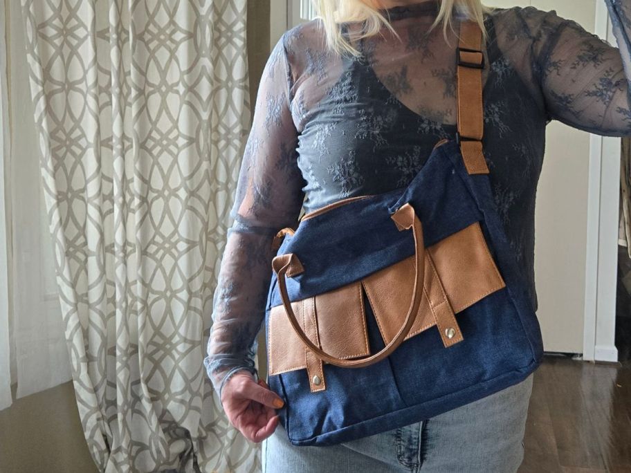 woman wearing blue and tan courier bag