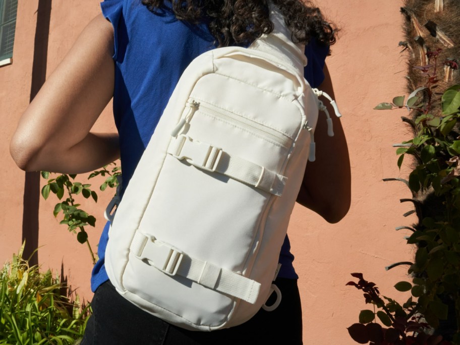 beige sling backpack