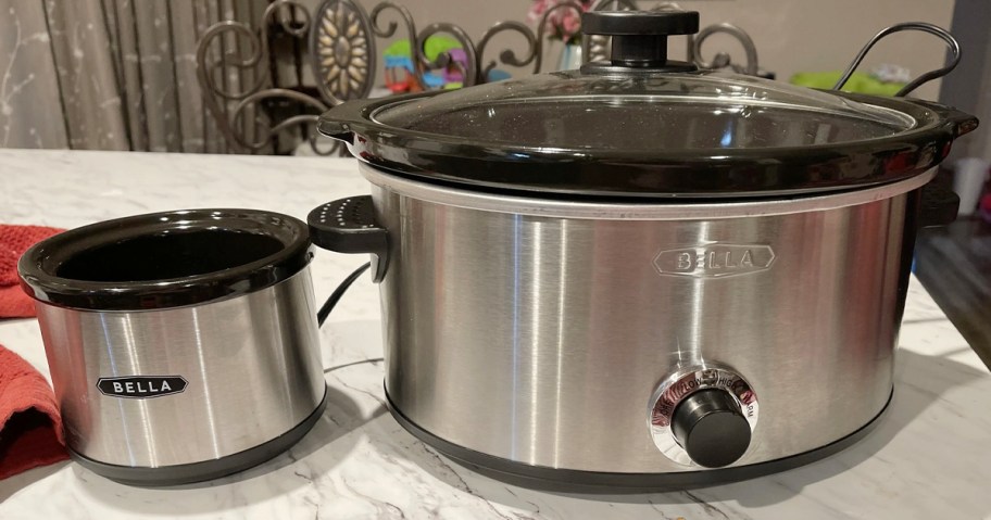 stainless steel slow cooker and mini pot on table