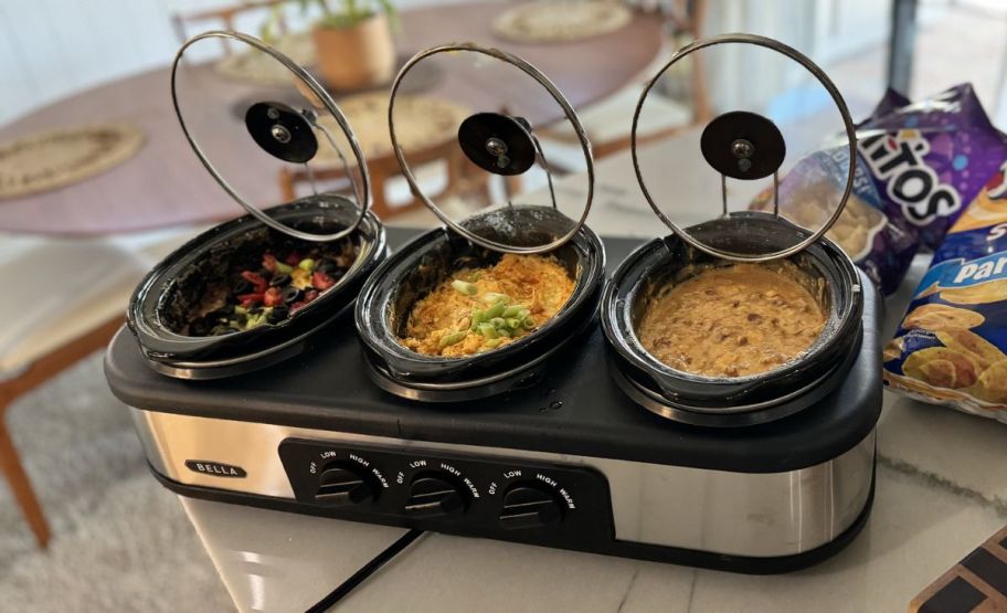 a bella triple slowcooker on a kitchen counter