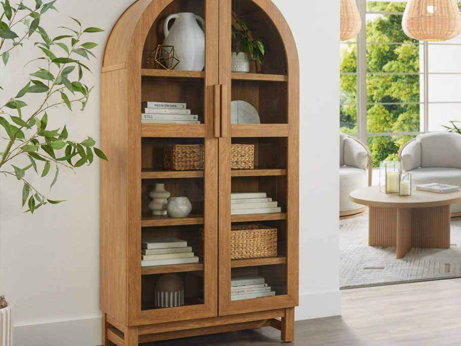 brown arch cabinet in living room 