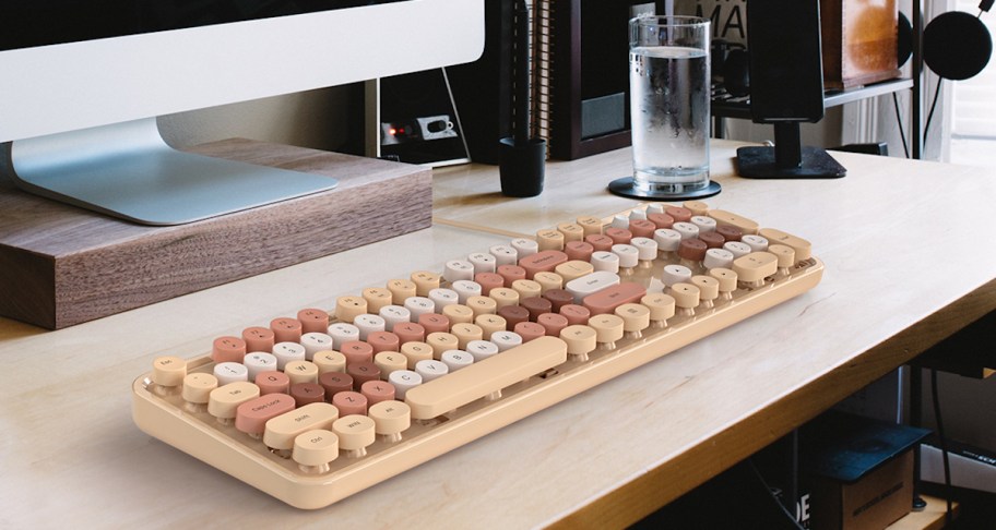 close up of beige colored keyboard on desk