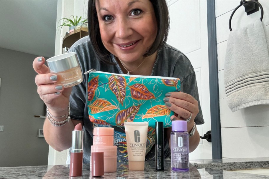 woman holding clinique moisturizer and cosmetic bag